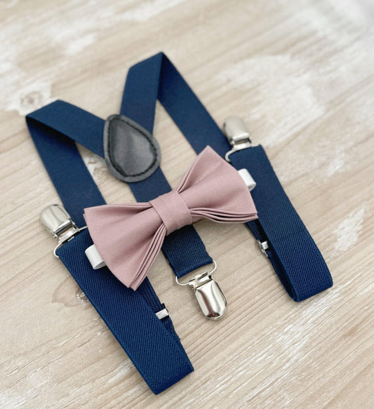May include: Navy blue suspenders with silver clips and a dusty rose bow tie.